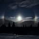Illustration for article titled A ring of illuminated ice crystals encircle an Alaskan moon